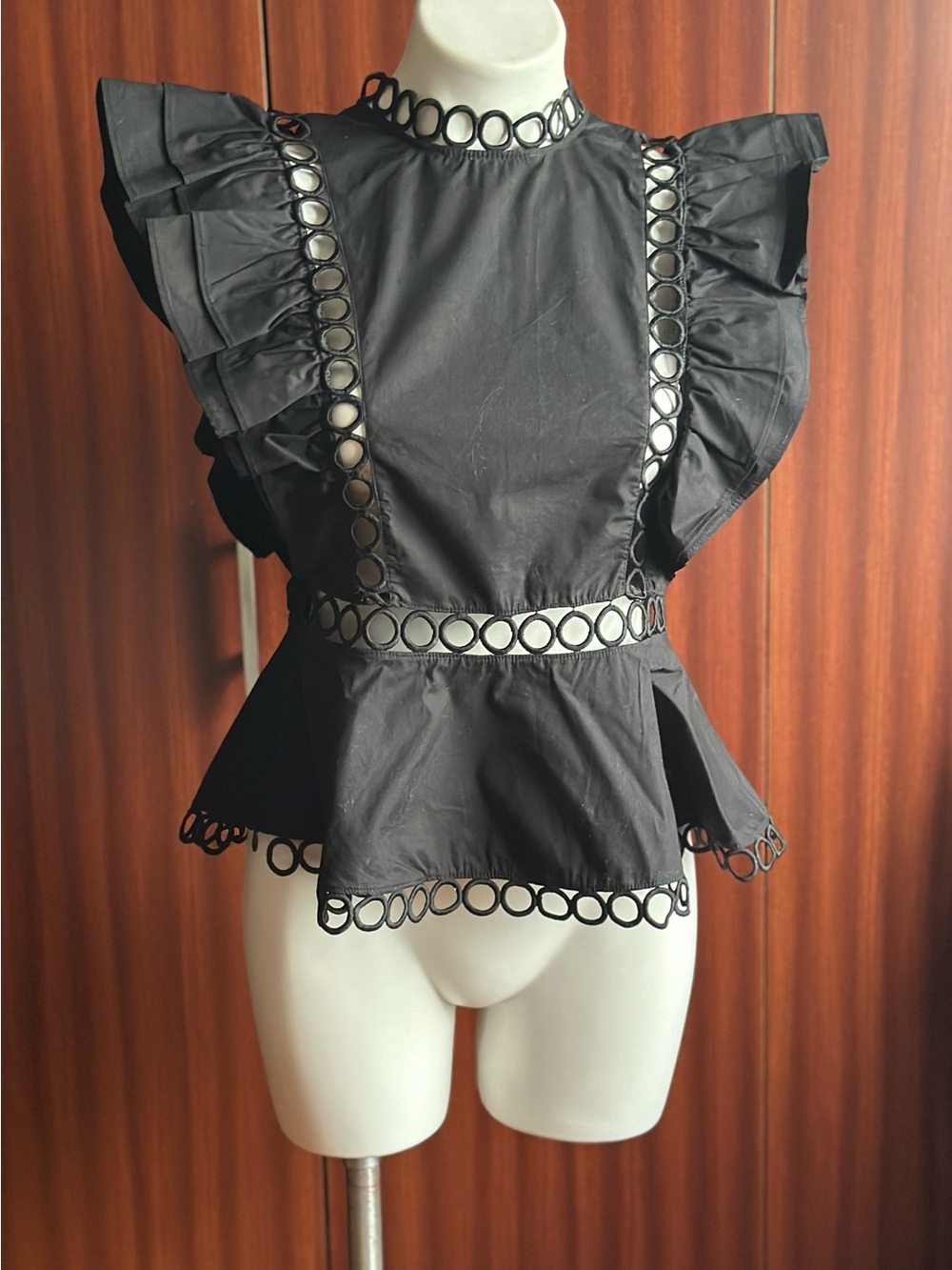 A stylish, sexy, and stunning blouse. It catches everyone's eye.  s M.
